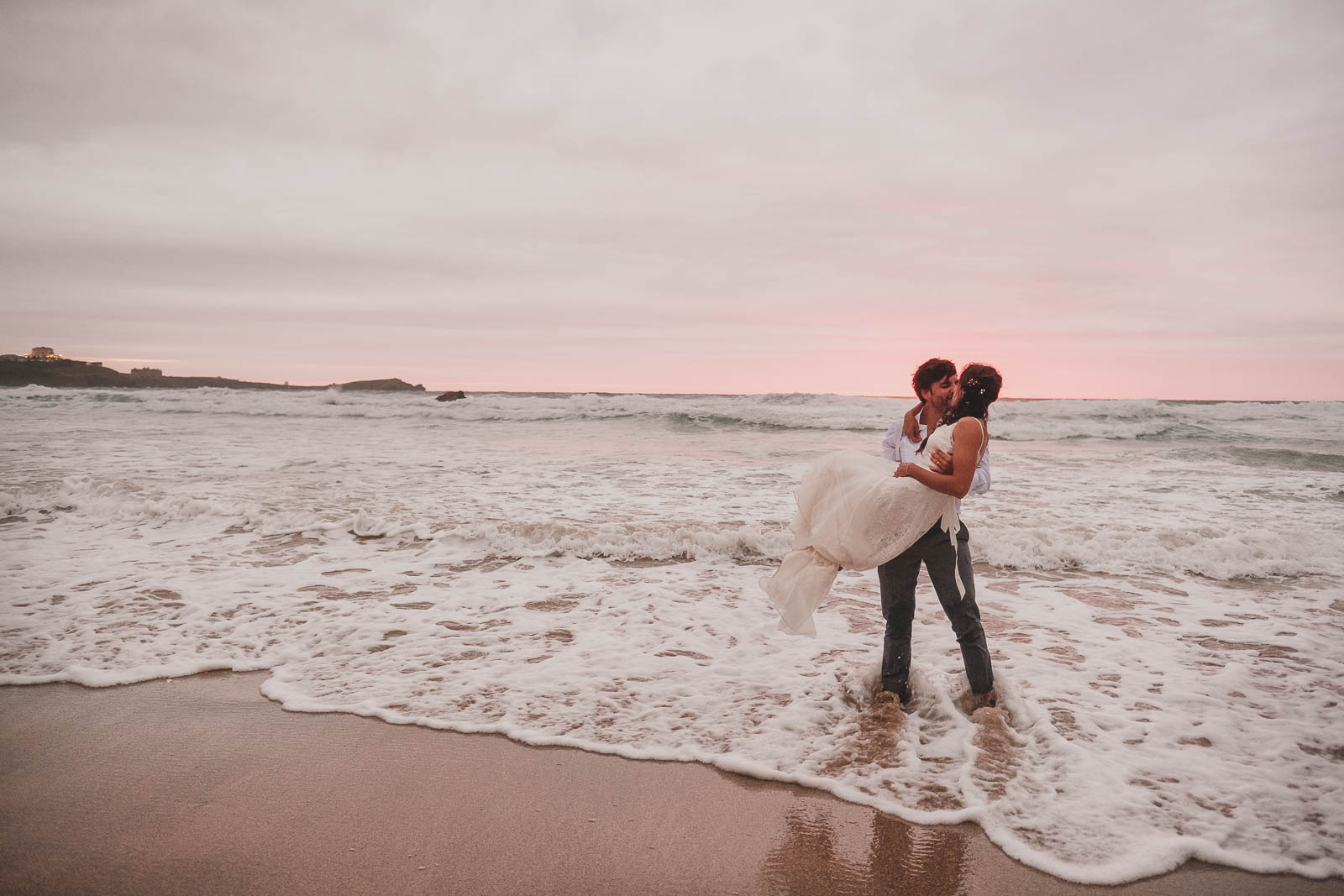 sunset on lusty glaze beach, a wedding venue in Newquay